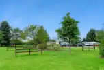Electric grass touring pitches with fences between