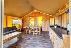 Safari tent with a kitchen and dining area, plus separate bedrooms