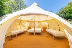 Bell tent with a double bed and two single camp beds (bring bedding)
