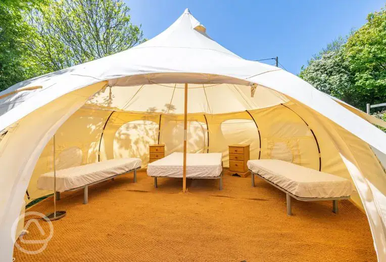 Bell tent with a double bed and two single camp beds (bring bedding)