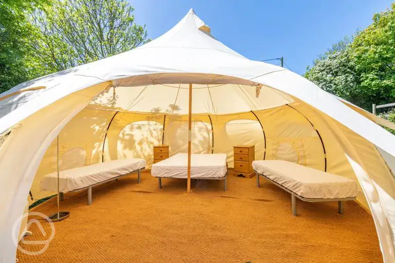 Bell tent with a double bed and two single camp beds (bring bedding)