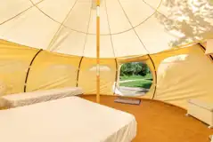 Bell tent with a double bed and two single camp beds (bring bedding)