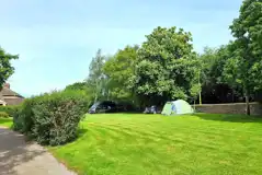 Electric grass pitches by the walled garden