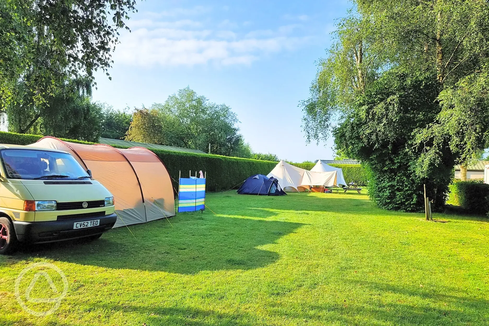 Non electric grass pitches backed by a hedge
