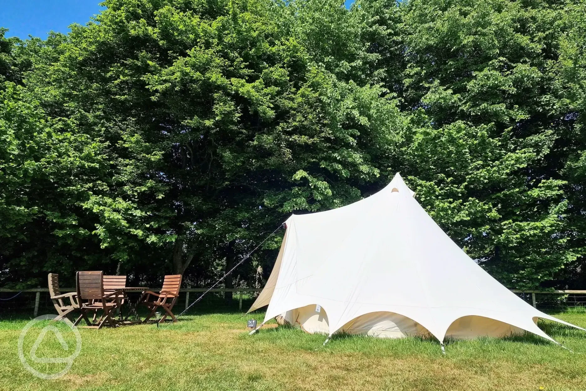 Furnished bell tent with outdoor seating