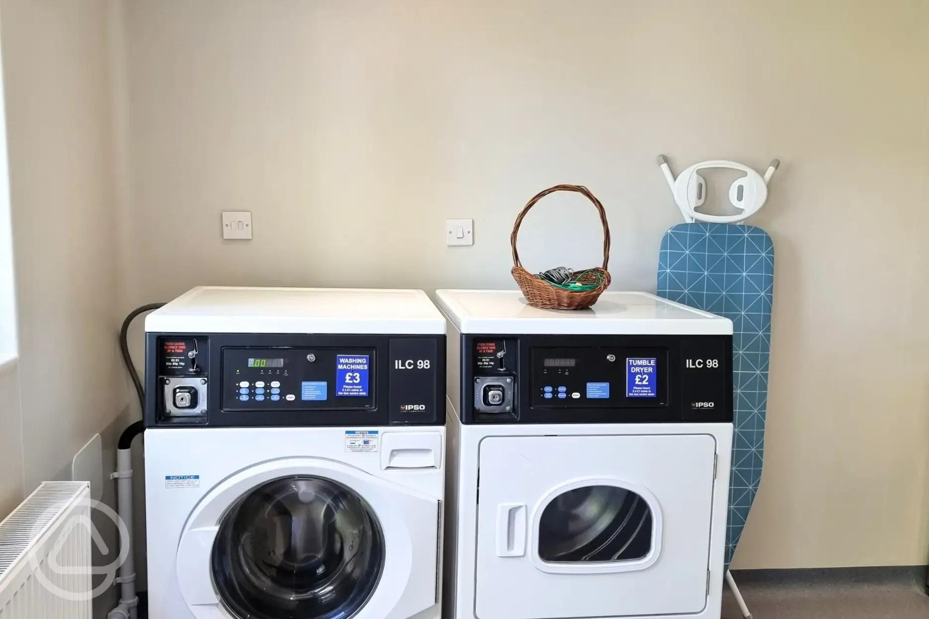 Laundry room with washer, dryer and ironing facilities