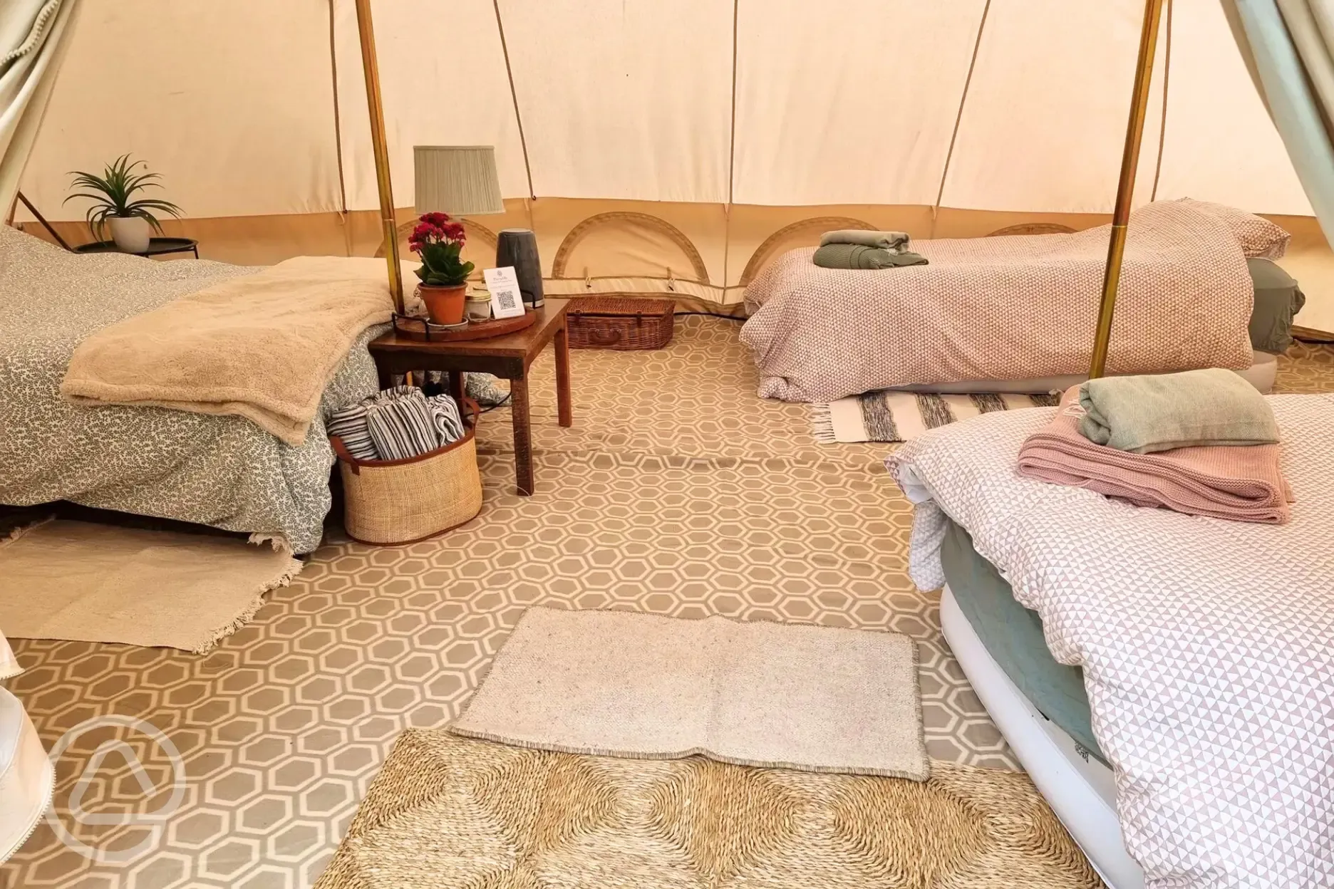 Large furnished bell tent with a double bed and up to three air beds