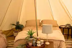 Furnished bell tent with a double bed and twin air beds Furnished bell tent with a double bed and twin air beds