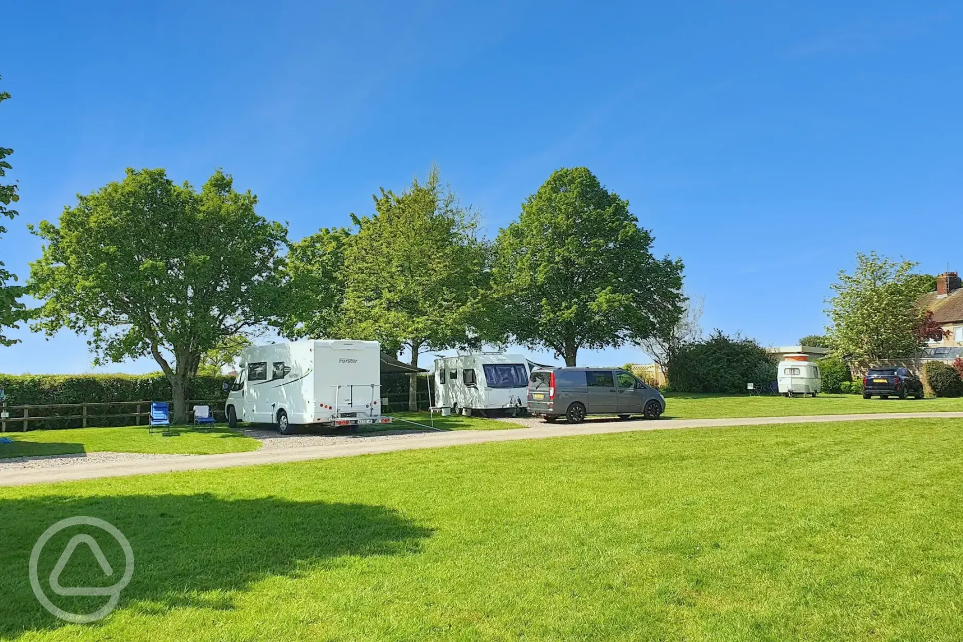 Electric hardstanding pitches with 16 amp hook ups and grass between pitches