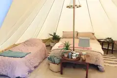 Furnished bell tent with a double bed and twin air beds Furnished bell tent with a double bed and twin air beds