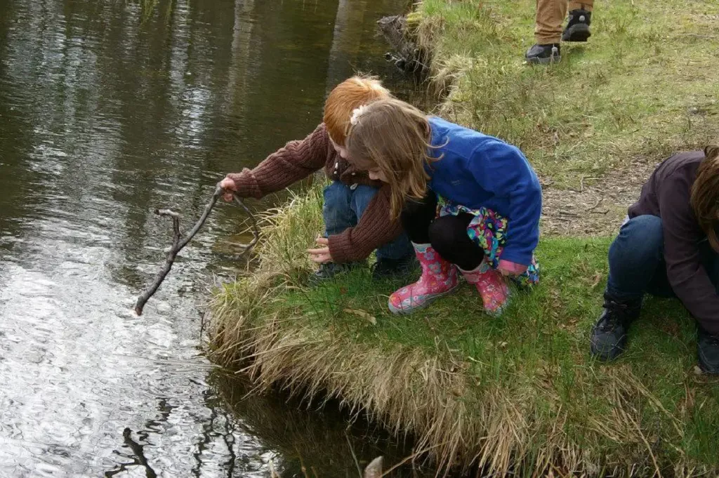 Children playing by the water at Glenesk