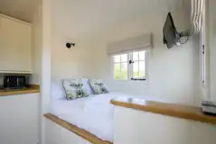 Shepherds hut king size bed and TV