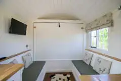 Strathmore shepherd's hut dining area and folding king size bed