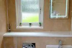 Shared bathroom with a light up mirror Shared bathroom with a light up mirror
