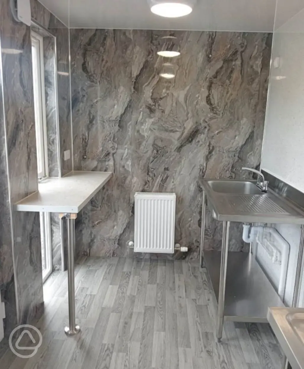 Indoor washing up area with sink Indoor washing up area with sink