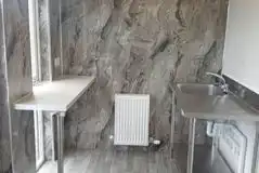 Indoor washing up area with sink Indoor washing up area with sink