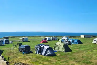 Grass pitches with sea views at Burrowhead Holiday Village