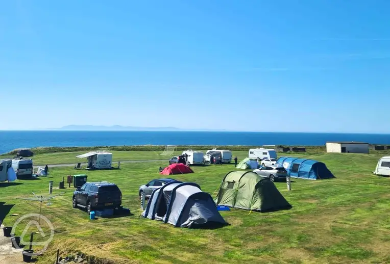 Grass pitches with sea views at Burrowhead Holiday Village