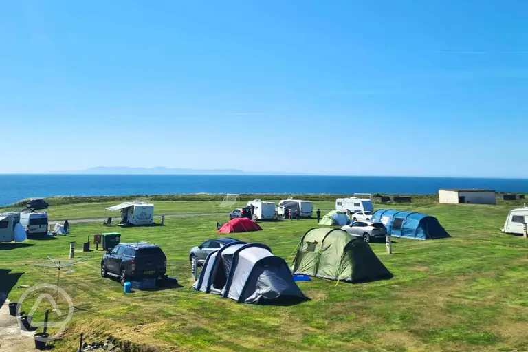 Grass pitches with sea views at Burrowhead Holiday Village