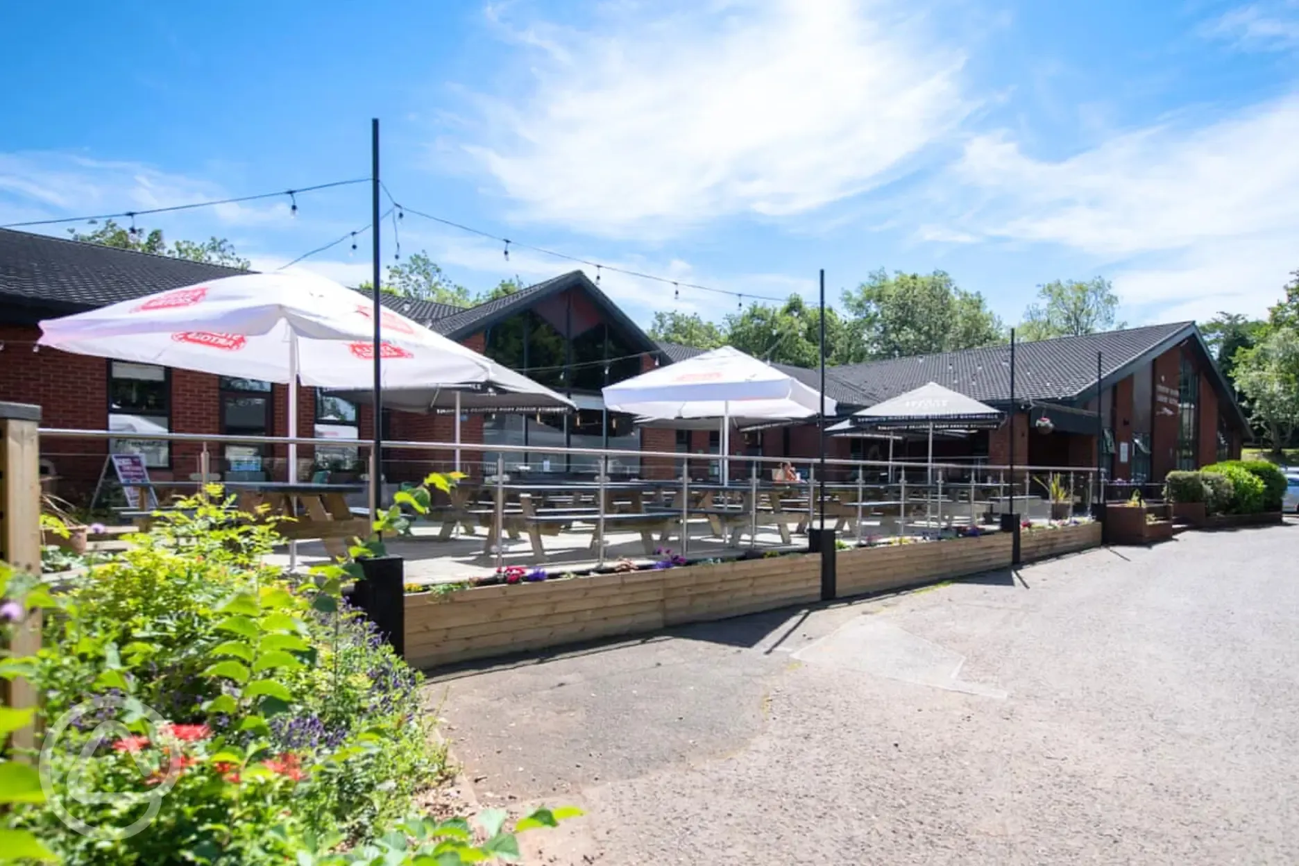 Main facilities/entertainment building with a beer garden area Main facilities/entertainment building with a beer garden area