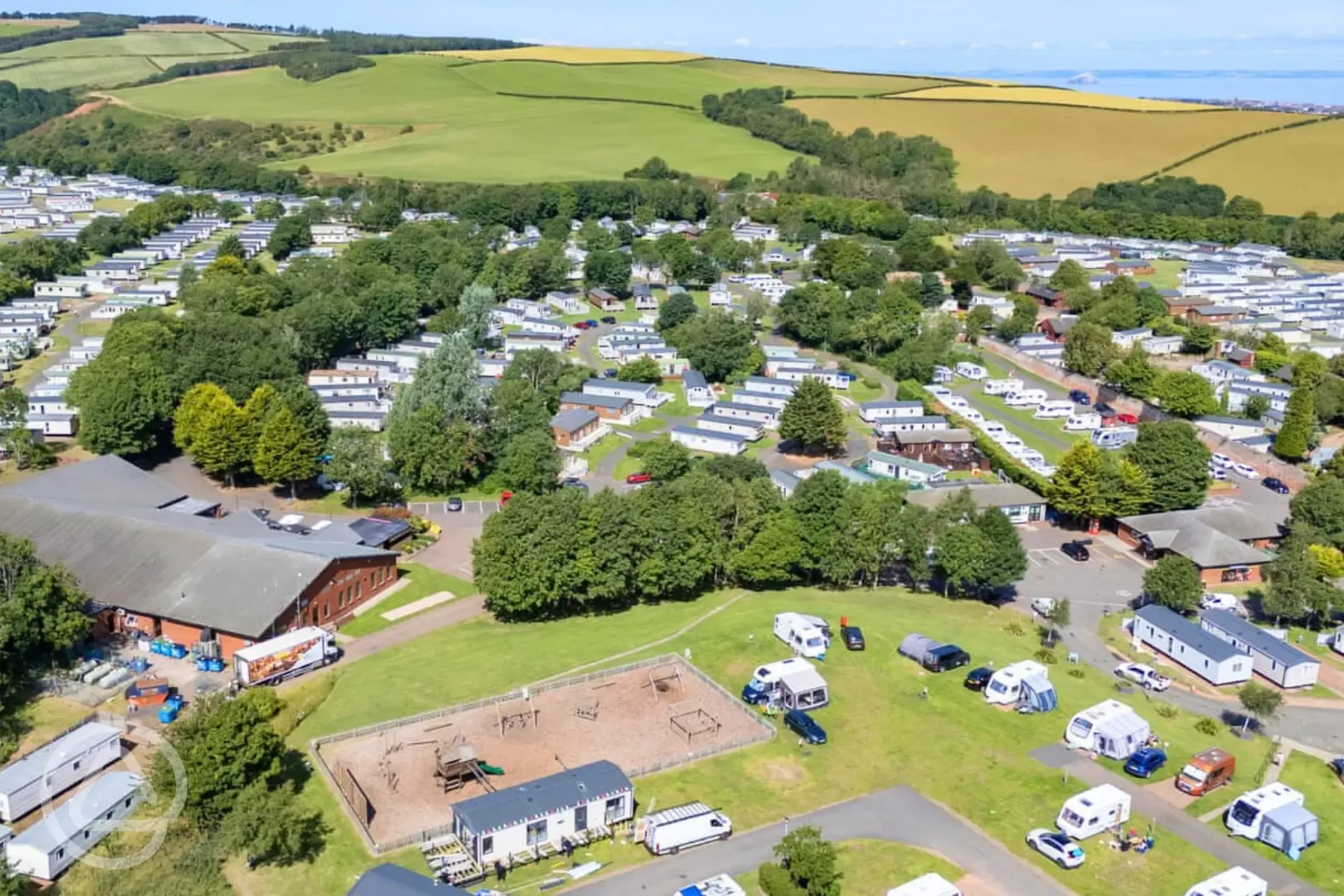 Aerial of Thurston Manor Leisure Park with the play park and facilities building Aerial of Thurston Manor Leisure Park with the play park and facilities building