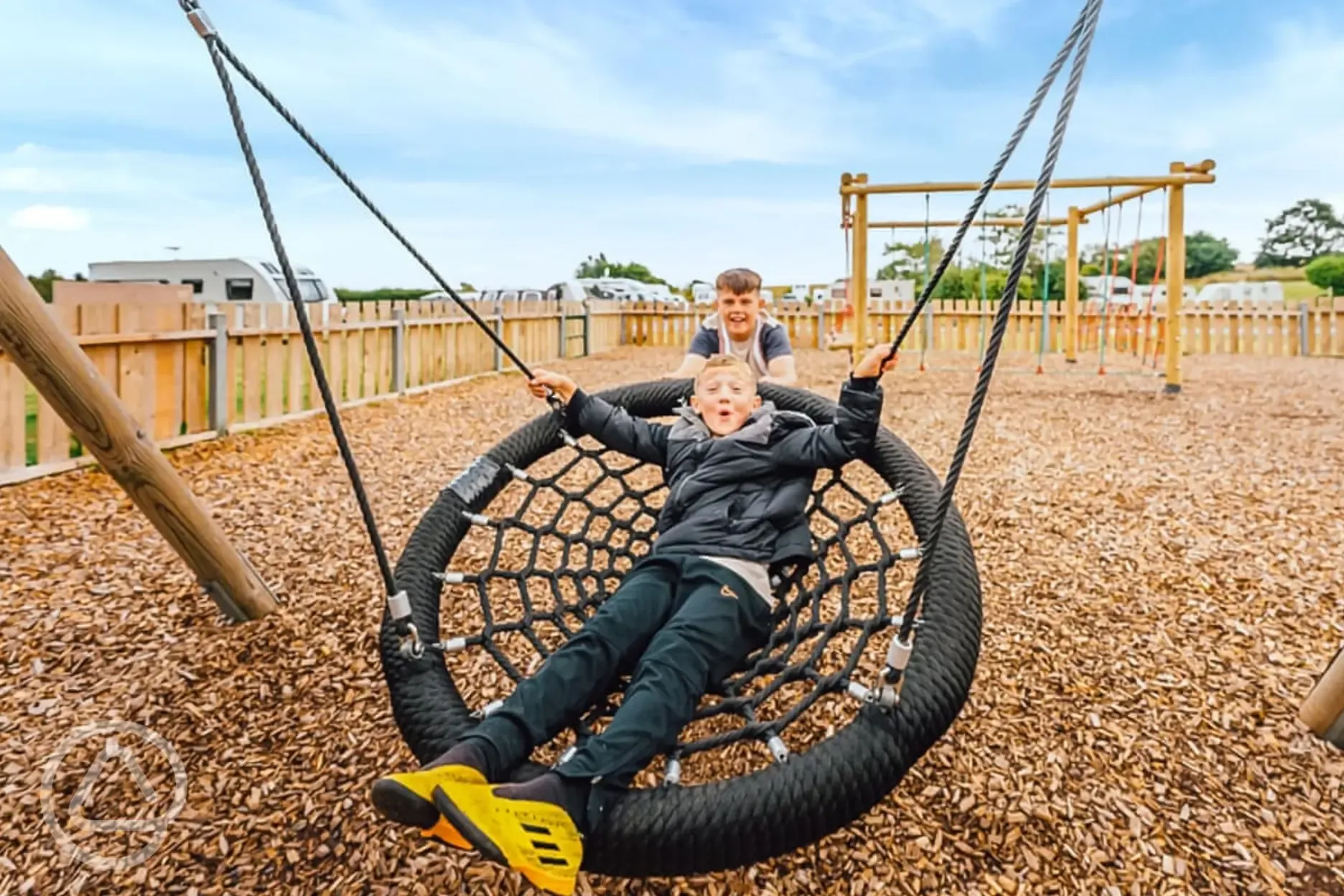Children's play area with a giant swing Children's play area with a giant swing
