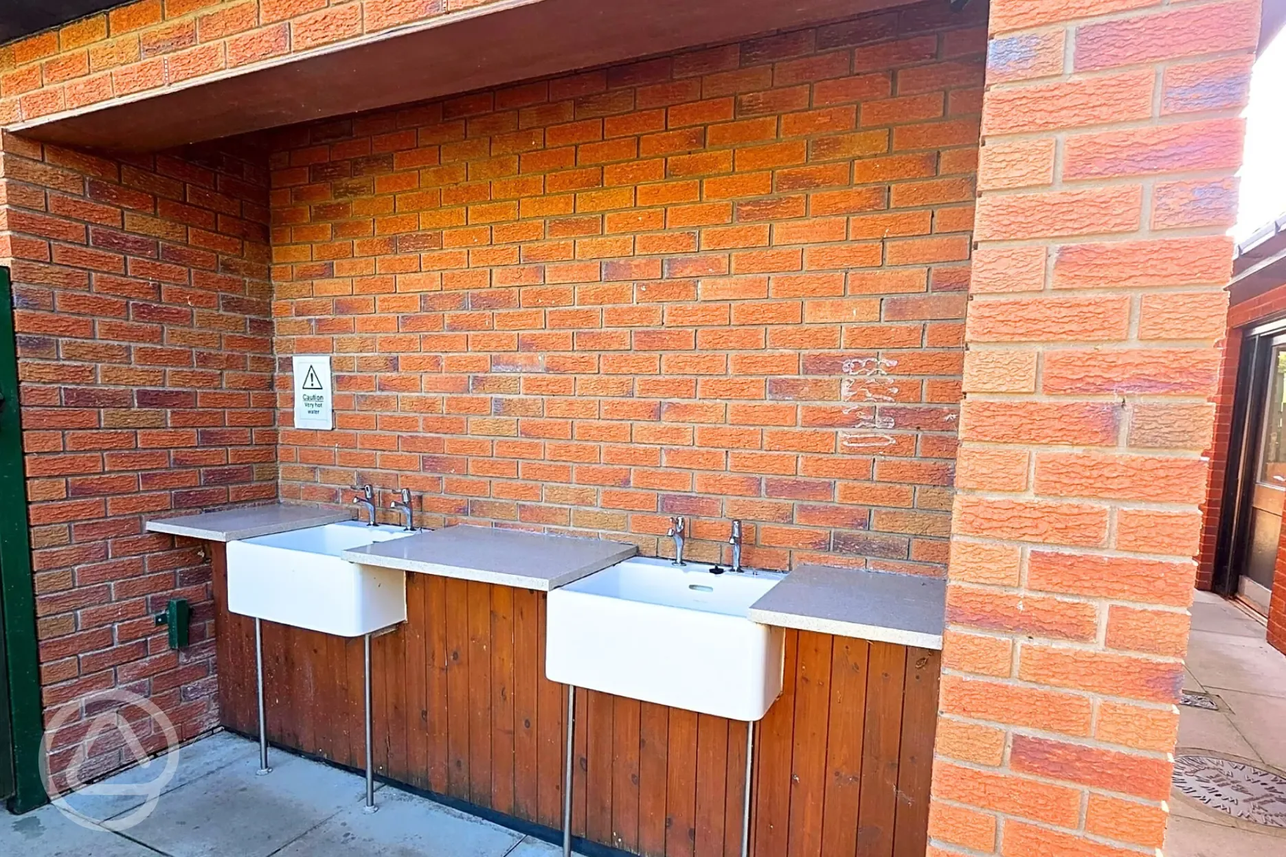 Sheltered, outdoor washing up area Sheltered, outdoor washing up area