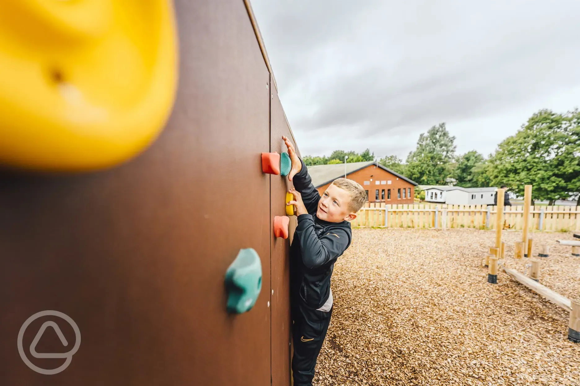 Children's play area with a climbing wall Children's play area with a climbing wall