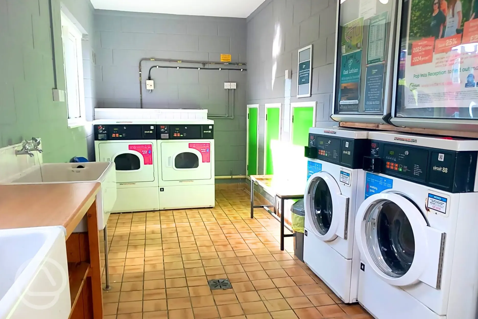 Indoor washing up area and coin-operated laundry machines Indoor washing up area and coin-operated laundry machines