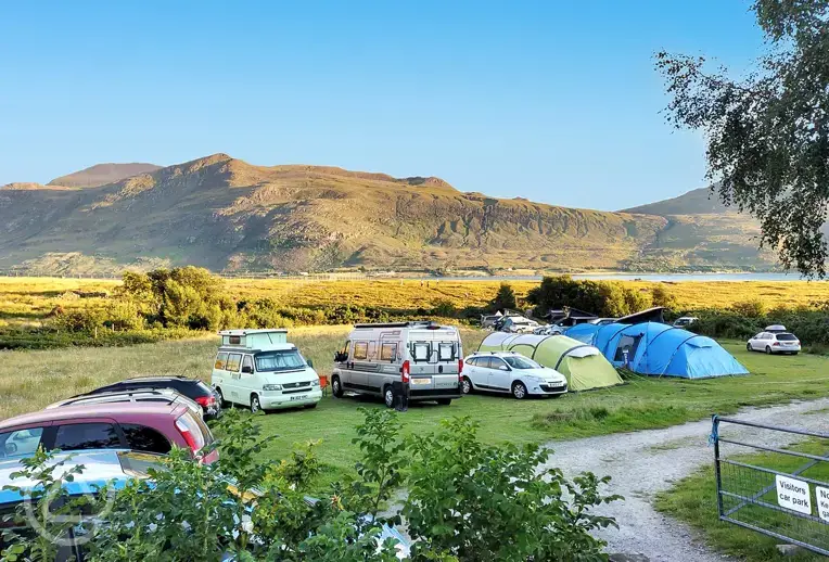 Grass pitches with views of Little Loch Broom