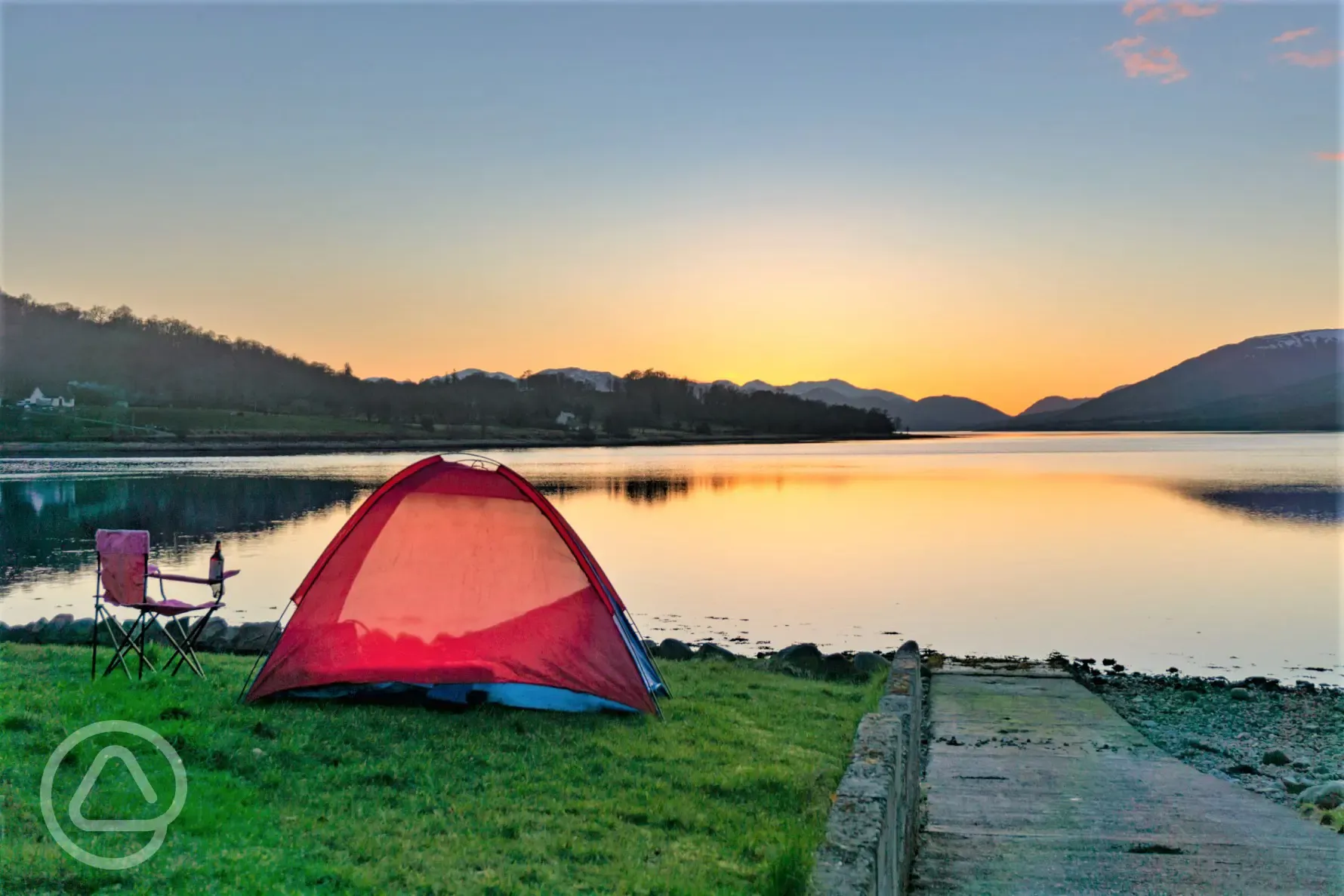 Non electric grass tent pitches overlooking Loch Eli at sunset