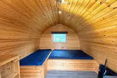Camping pod interior with a double and single bed (please bring bedding)