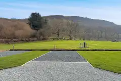 Electric hardstanding and grass pitches with views over the Cambrian mountains