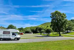 Electric hardstanding pitches (4m x 9m) with a grass area between each pitch Electric hardstanding pitches (4m x 9m) with a grass area between each pitch