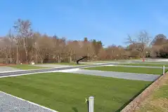 Electric hardstanding and grass pitches with a 4m x 9m grass area