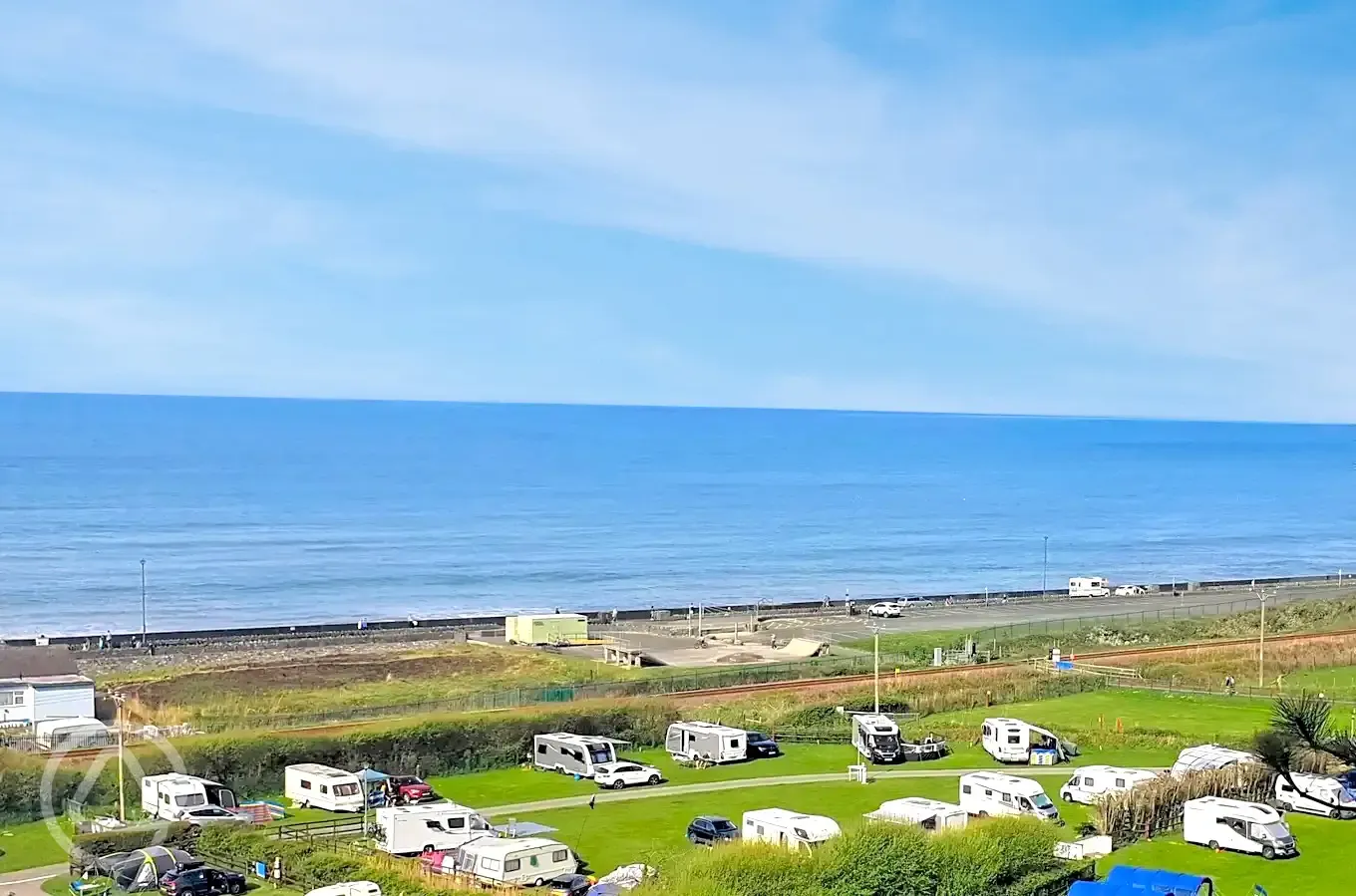 Aerial of the grass pitches with sea views