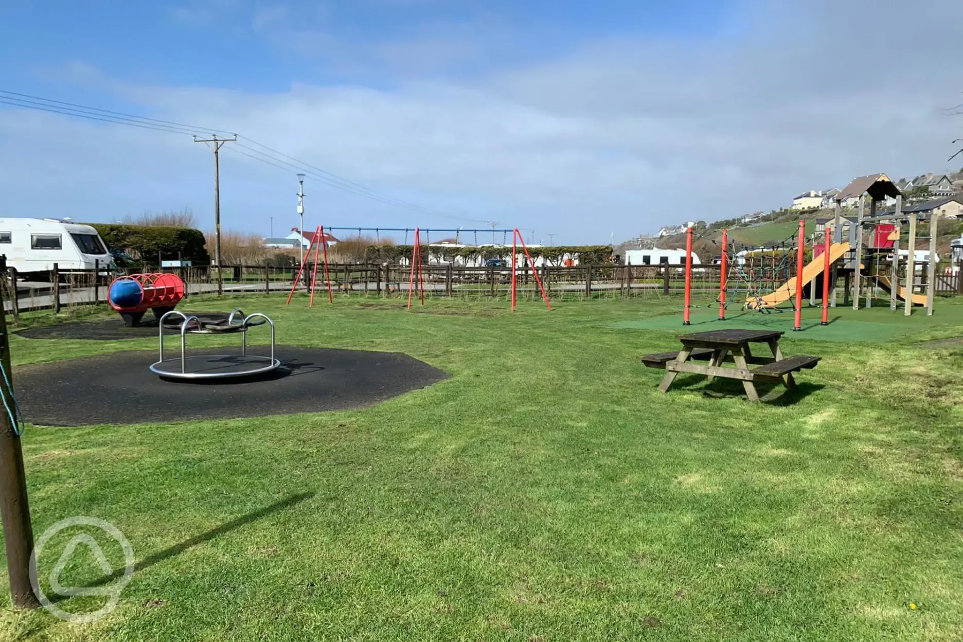 Play park with swings and a climbing frame