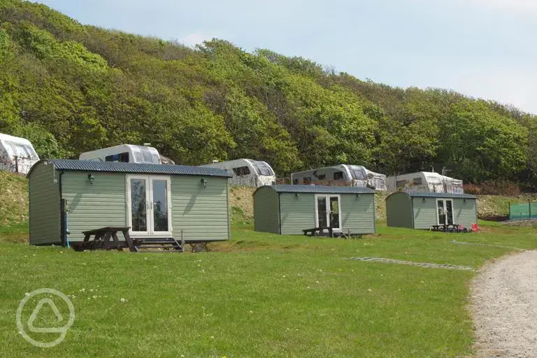 Shepherd's huts with path access