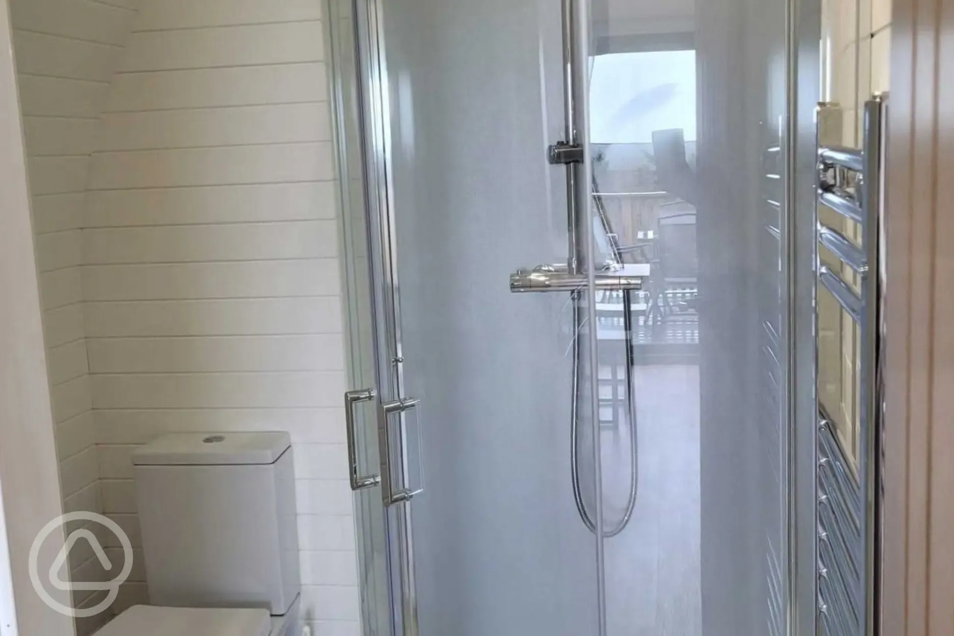 Gwel yr Bae large glamping pod ensuite with a toilet, shower and hand basin