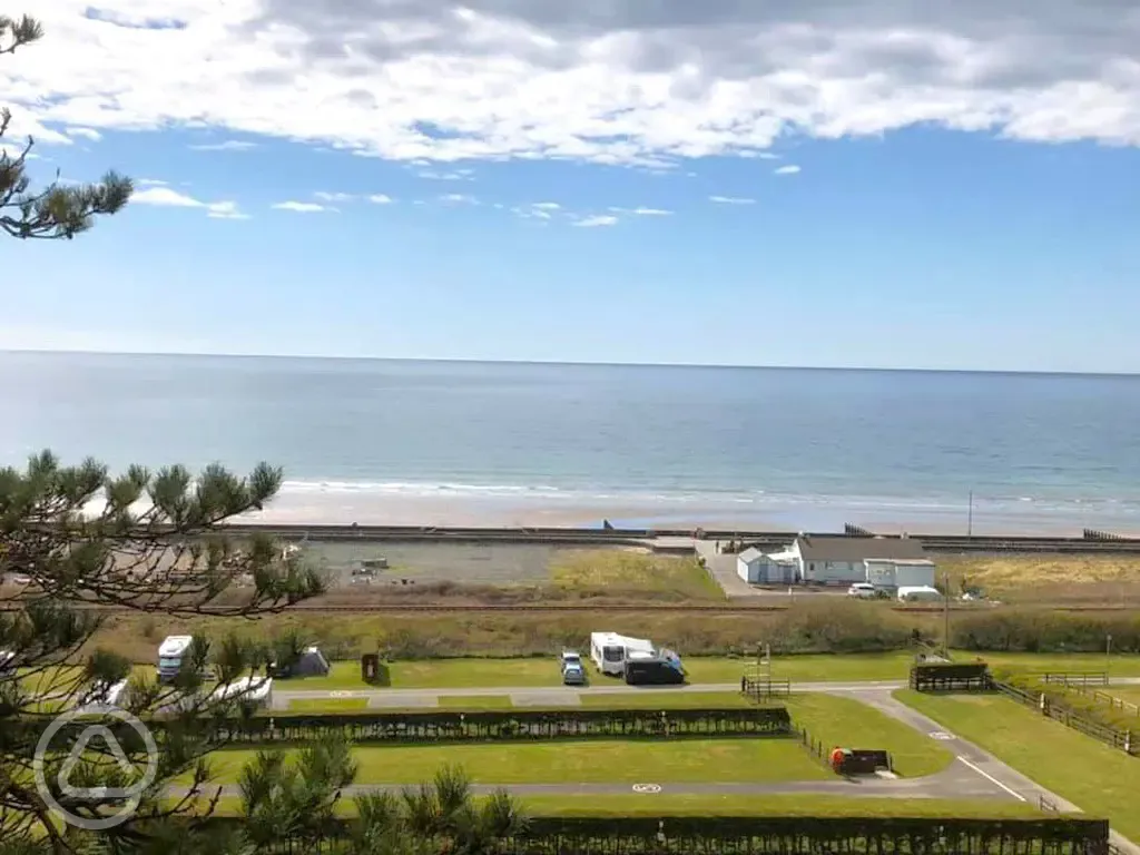 Aerial of the grass pitches with sea views