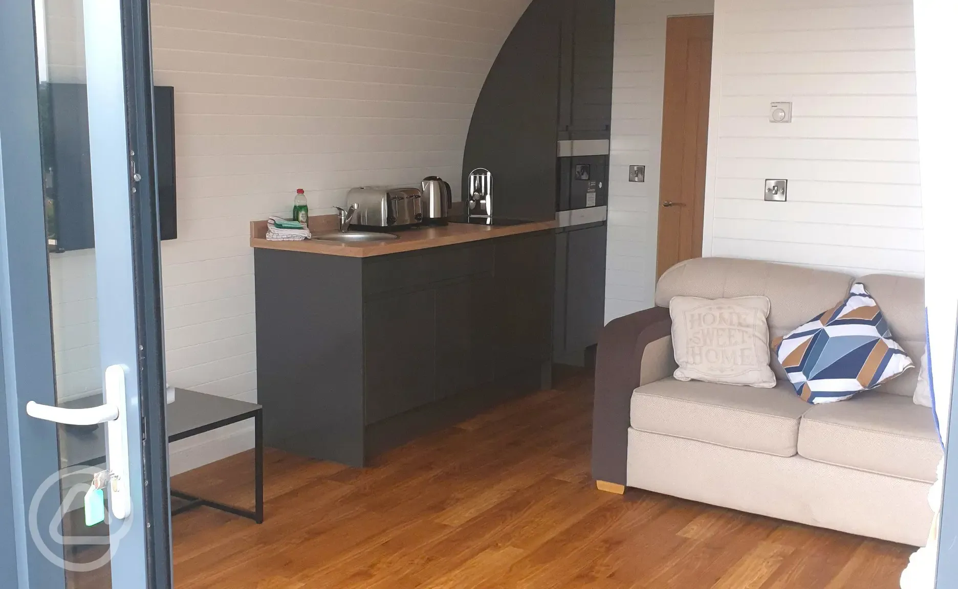 Gwel yr Bae large glamping pod with a double sofa bed and kitchen