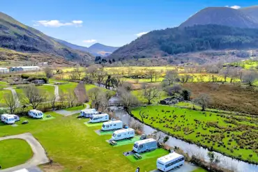 Aerial of the pitches onsite with views over Snowdonia National Park (Eryri) 