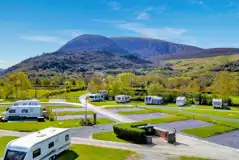 Aerial of Bryn Gloch with the backdrop of Snowdonia National Park (Eryri) 