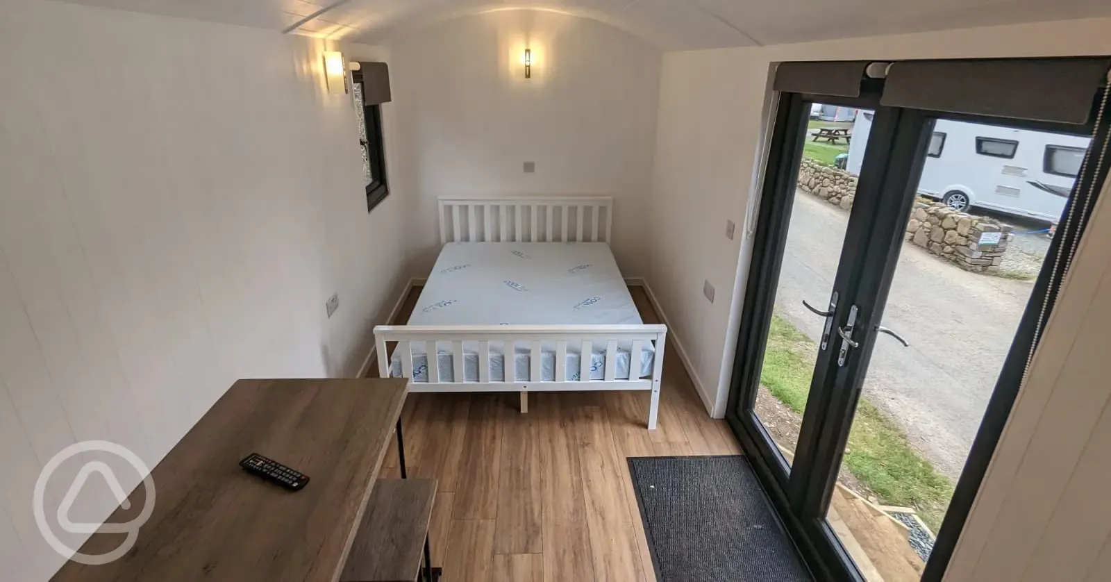 Shepherd's hut interior with a double bed (bedding not included)