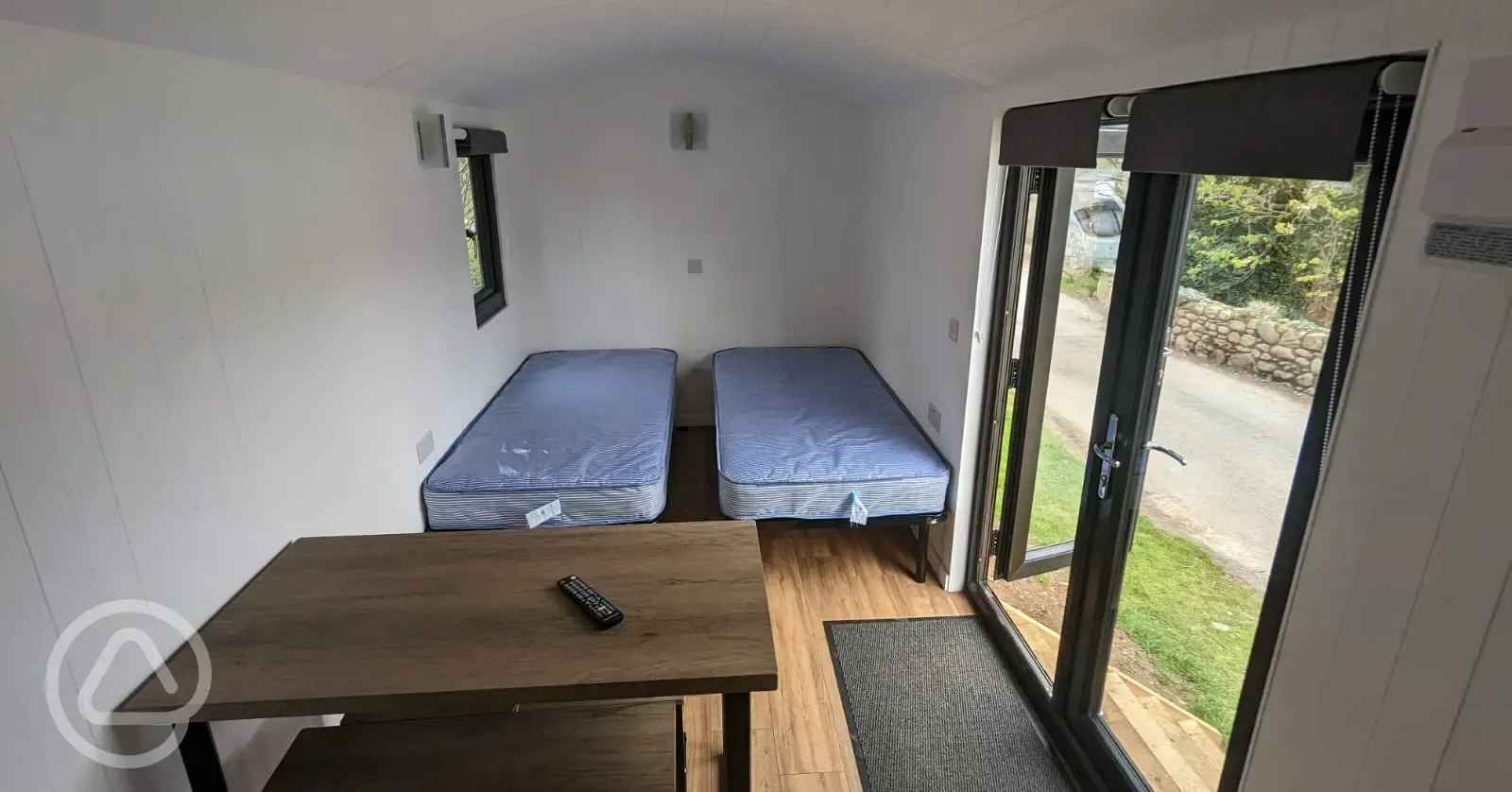 Shepherd's hut interior with two single beds (bedding not included)