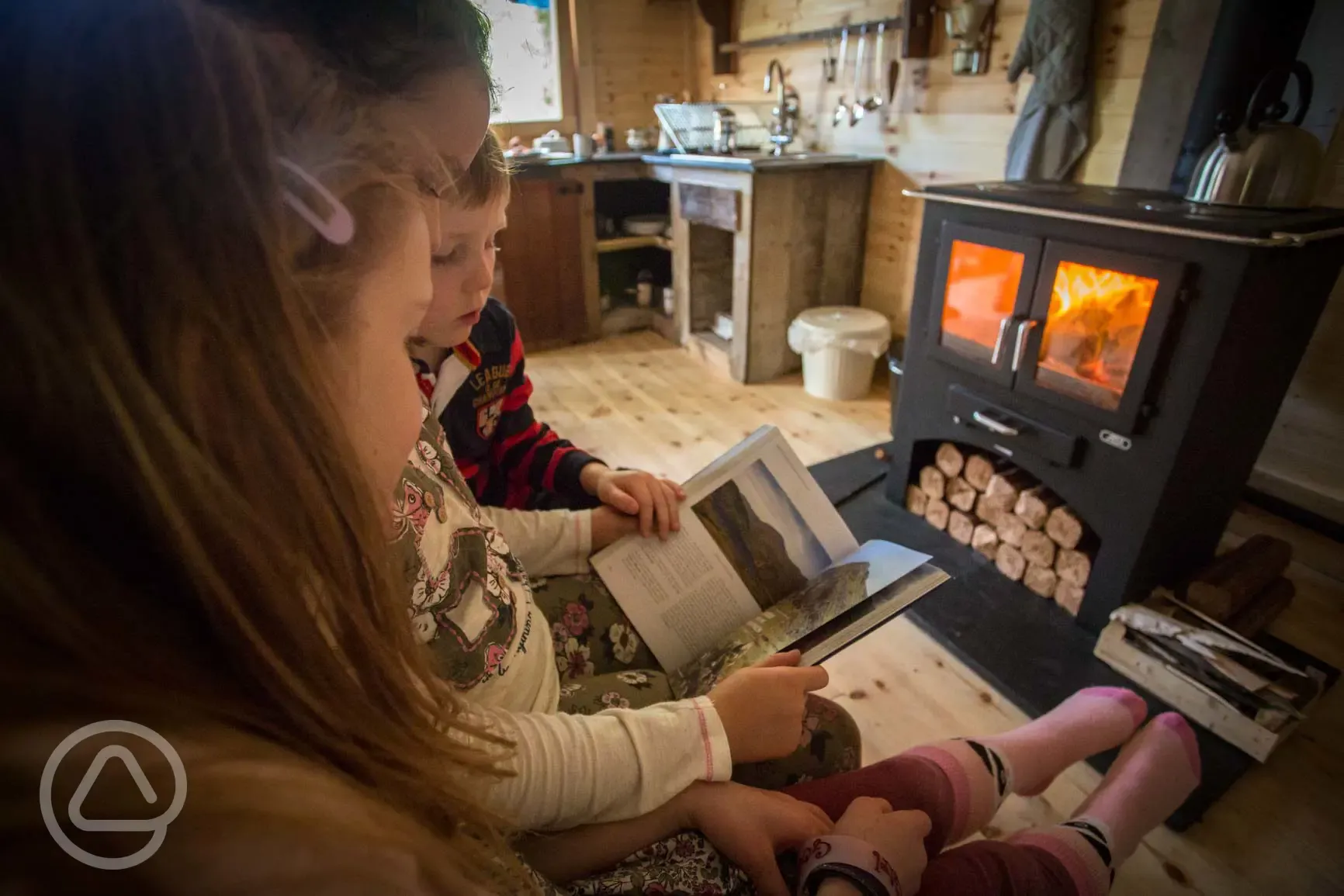 Log stove and kitchen area