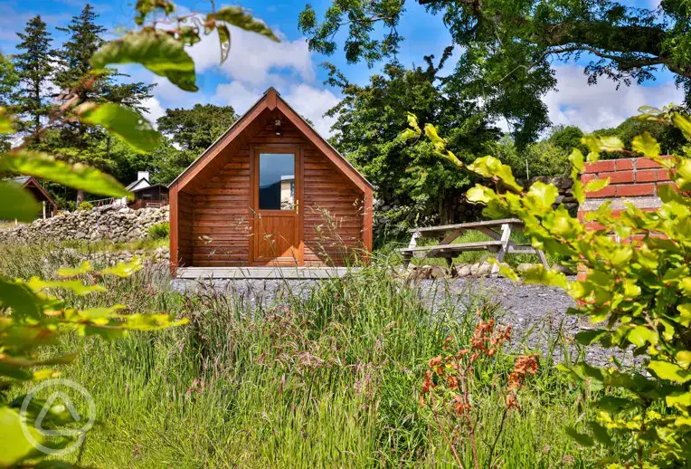 Camping pods (dog friendly) with a picnic bench