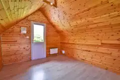 Unfurnished camping pod interior with heating and lighting