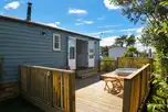 Shepherd's hut with a deck, outdoor seating and hot tub
