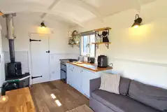 Shepherd's hut kitchen and log burner